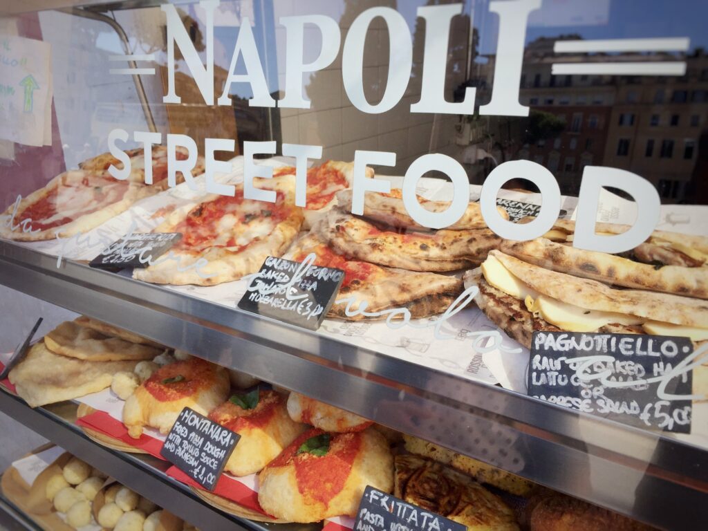 Neapolitan Street food stand. Calzone fritto, Pagnottiello and Pizza among the traditional dishes offered for sale
